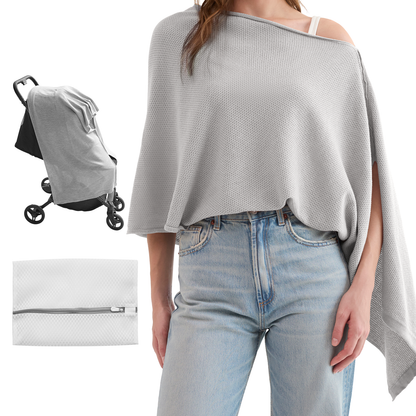 Light gray nursing poncho draped over shoulder with asymmetrical hem