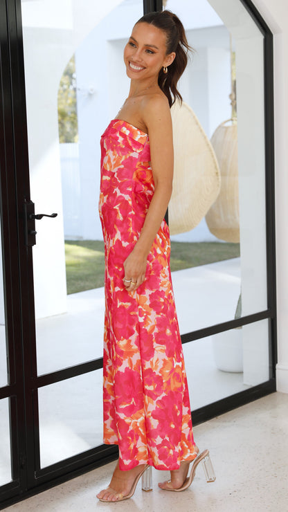 Side view of pink floral strapless midi dress with ruched bodice and flower print