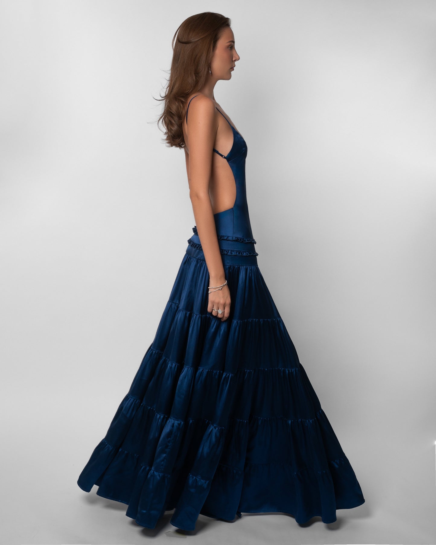Navy maxi dress with open back cutout and voluminous tiered skirt