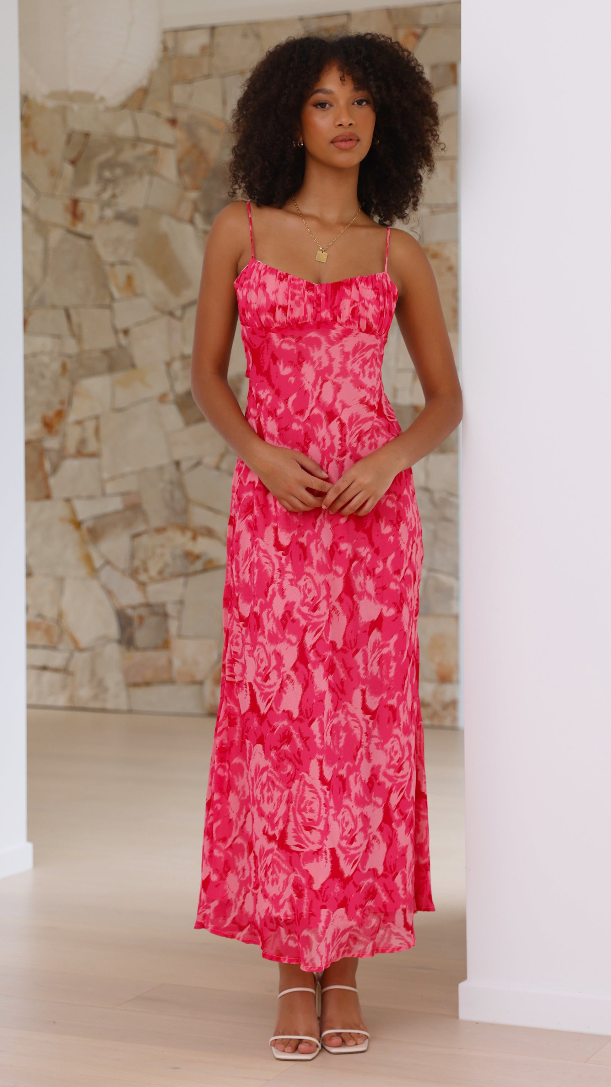 pink floral midi dress with spaghetti straps and ruched neckline