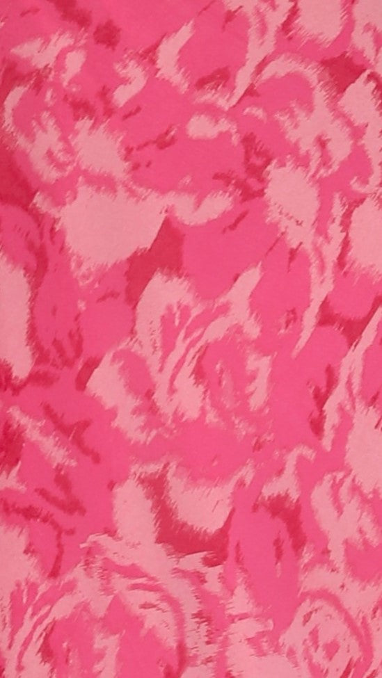 Close-up of pink rose floral fabric with textured print pattern