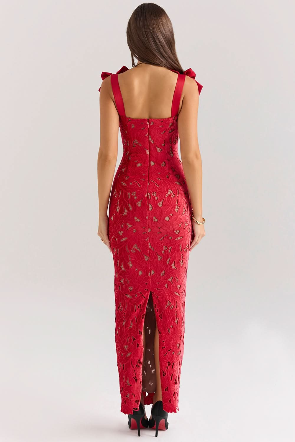 Red lace maxi dress back view with bow shoulder details and center slit