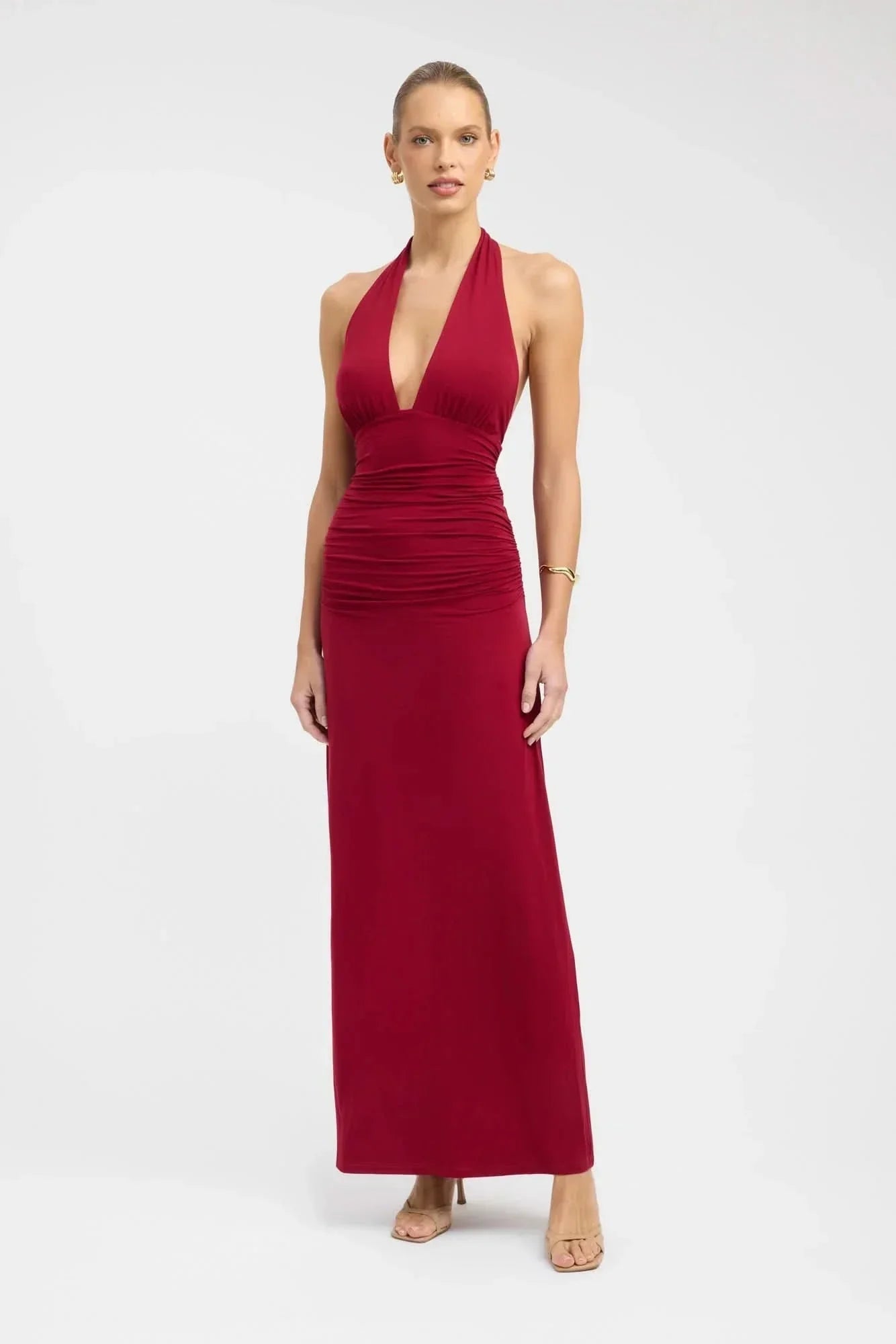 Blue halter maxi dress with deep V-neckline and ruched bodice