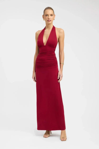 Blue halter maxi dress with deep V-neckline and ruched bodice